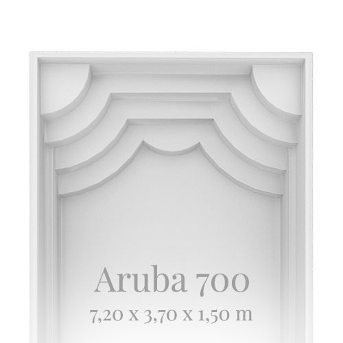 "Innenansicht einer weißen rechteckigen Struktur mit gewölbten Details und grauem Text 'Aruba 700'."